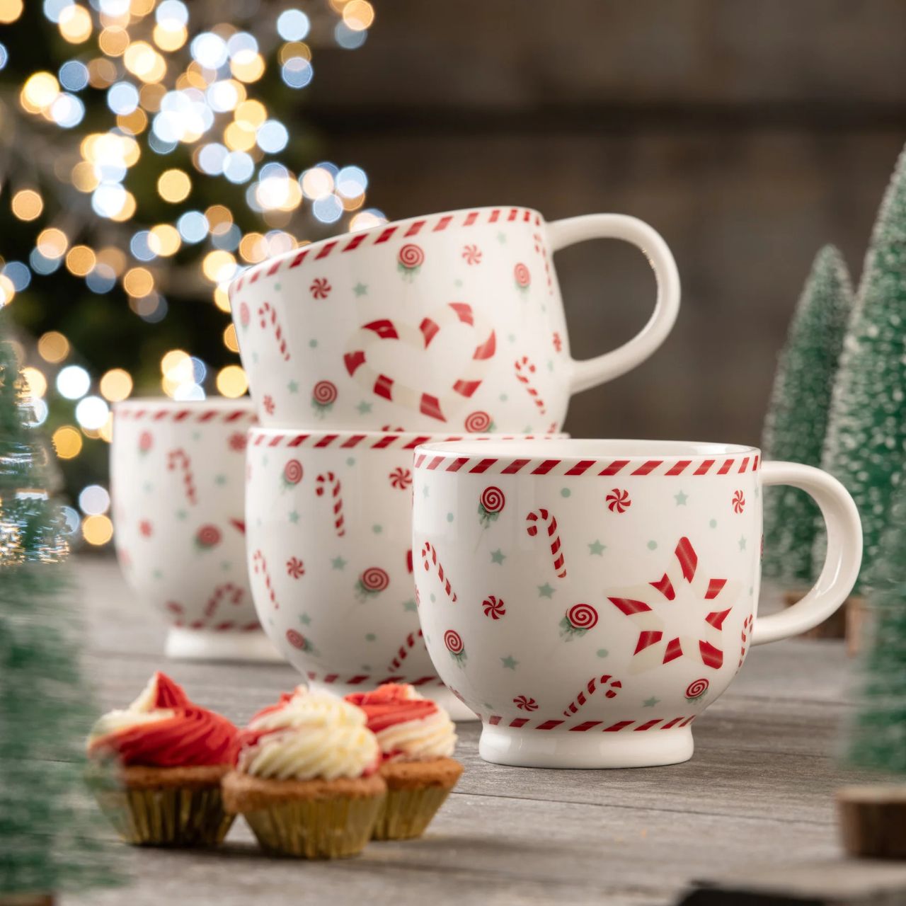 These large capacity footed mugs feature a playful pattern of festive sweets with candy cane stripe details. Ideal for decadent hot chocolates or your favourite hot drinks during the festive season. Beautifully boxed in a matching gift box these mugs would make for an ideal gift.