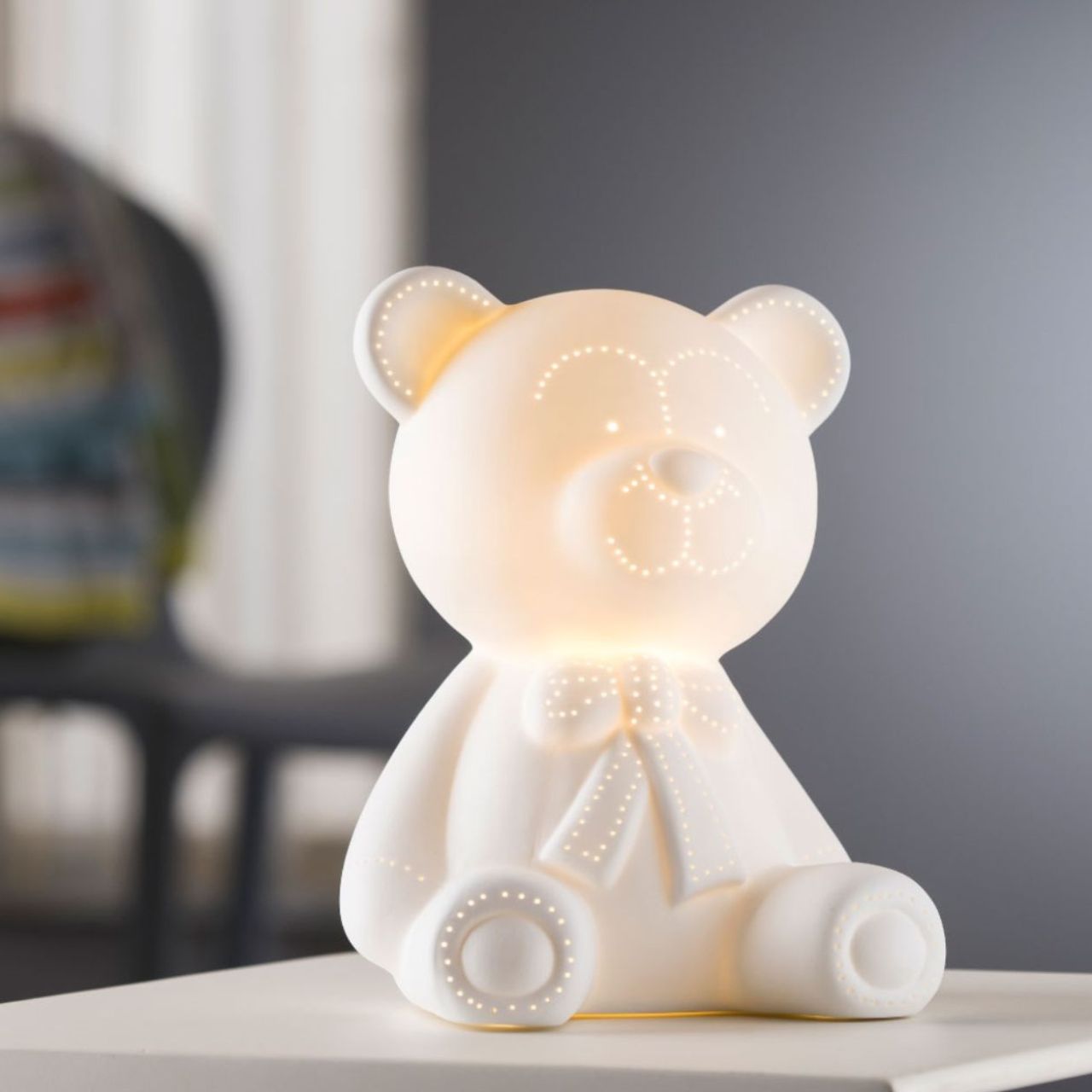 This Teddy Bear Luminaire is simply stunning. Ideal for a nursery or children's bedroom, this Teddy Bear is an ideal bedside lamp and it is sure to create a soft mood to allow your little ones to drift off to sleep.