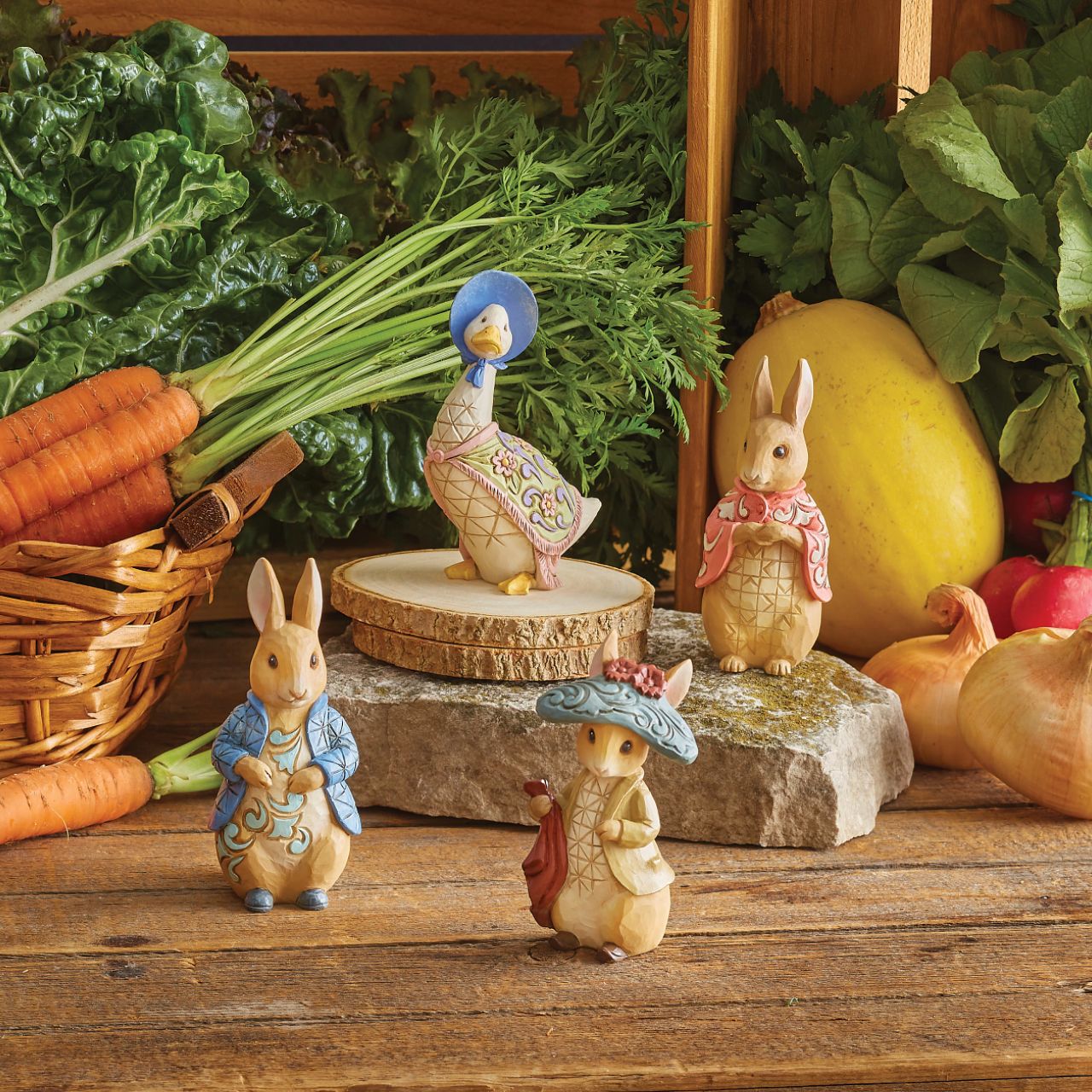 Benjamin Bunny, Peter Rabbit's lovable cousin, brings a flower for you and kindness to your home. Wearing his characteristic hat, the little bunny waits patiently for the next adventure. Exquisitely crafted by Jim Shore, Benjamin boasts with beauty.