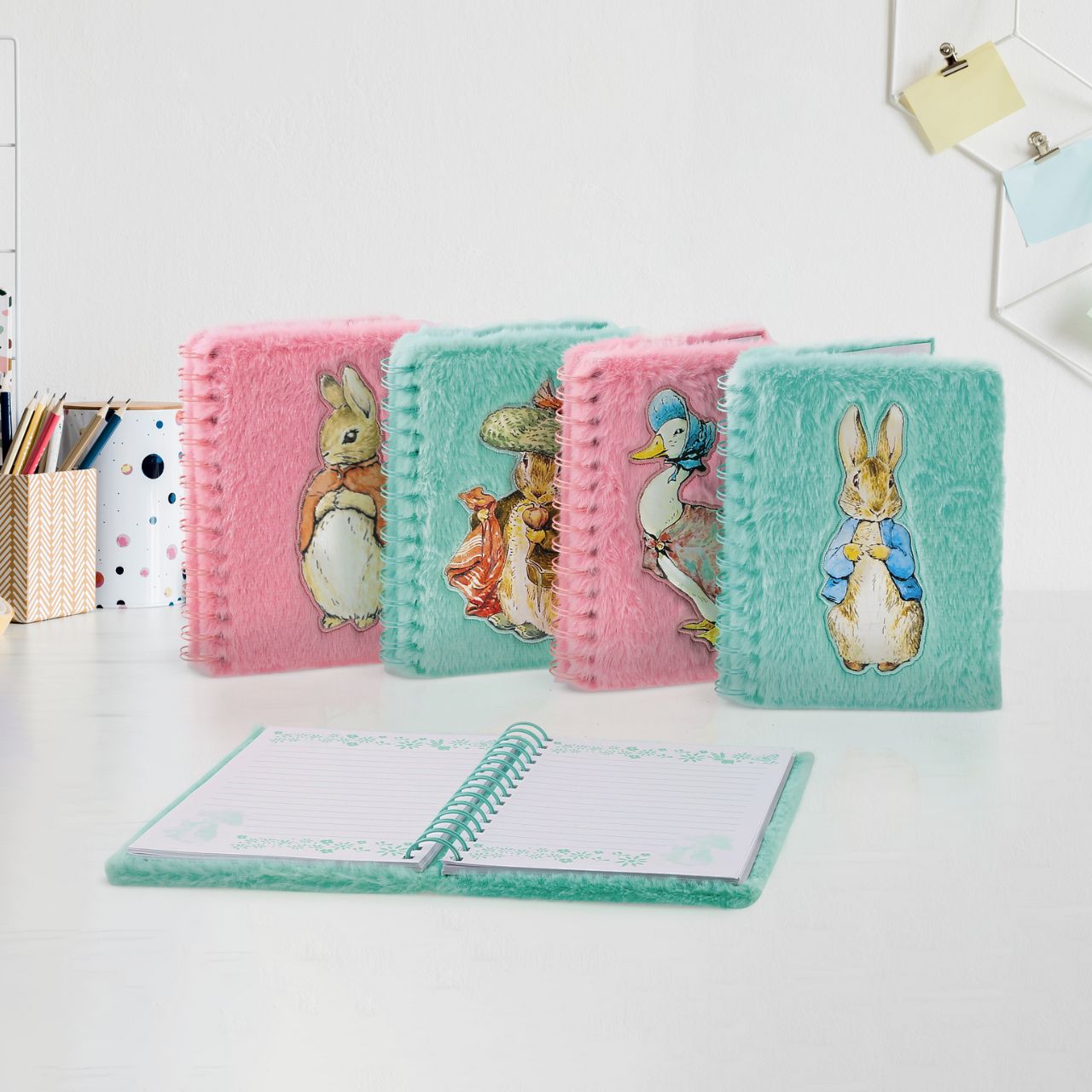 Step into the enchanting world of Beatrix Potter with this delightful Benjamin Bunny Notebook, adorned with a plush cover that feels as soft as a bunny's fur.
