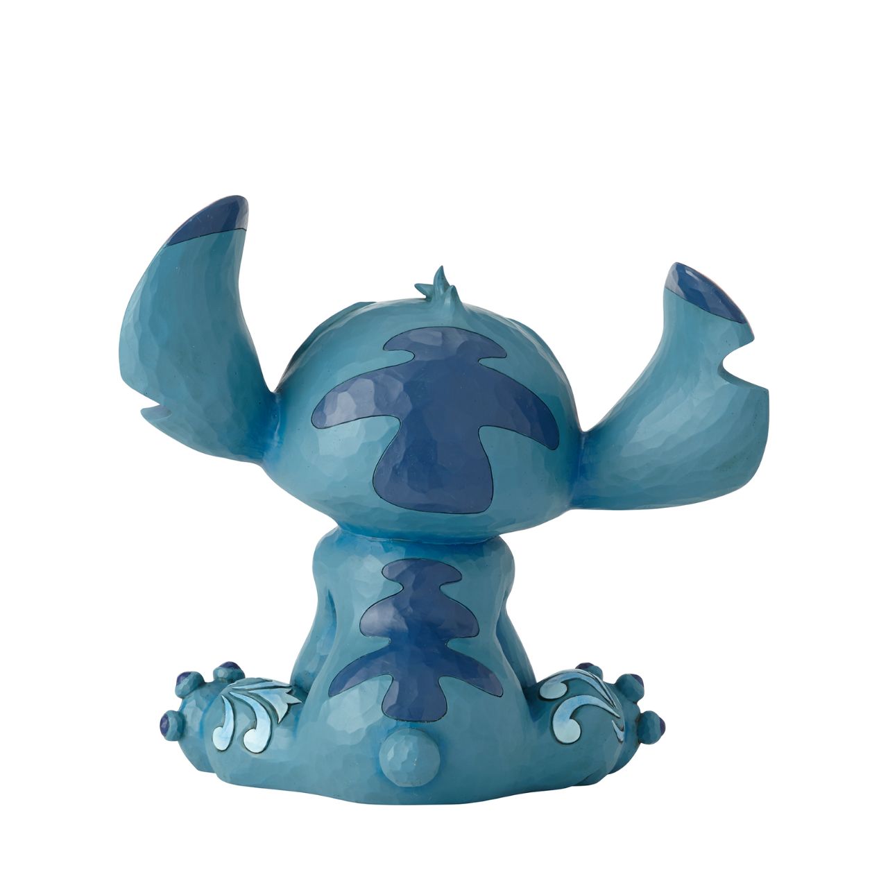 Disney Traditions Big Trouble Stitch Statement Figurine  It's hard to believe this sweet face could be behind so much chaos| Stitch, the troublesome alien from Disney's "Lilo and Stitch" strikes an innocent pose in this handcrafted design, sculpted from cast stone and hand-painted with whimsical folk-art details.