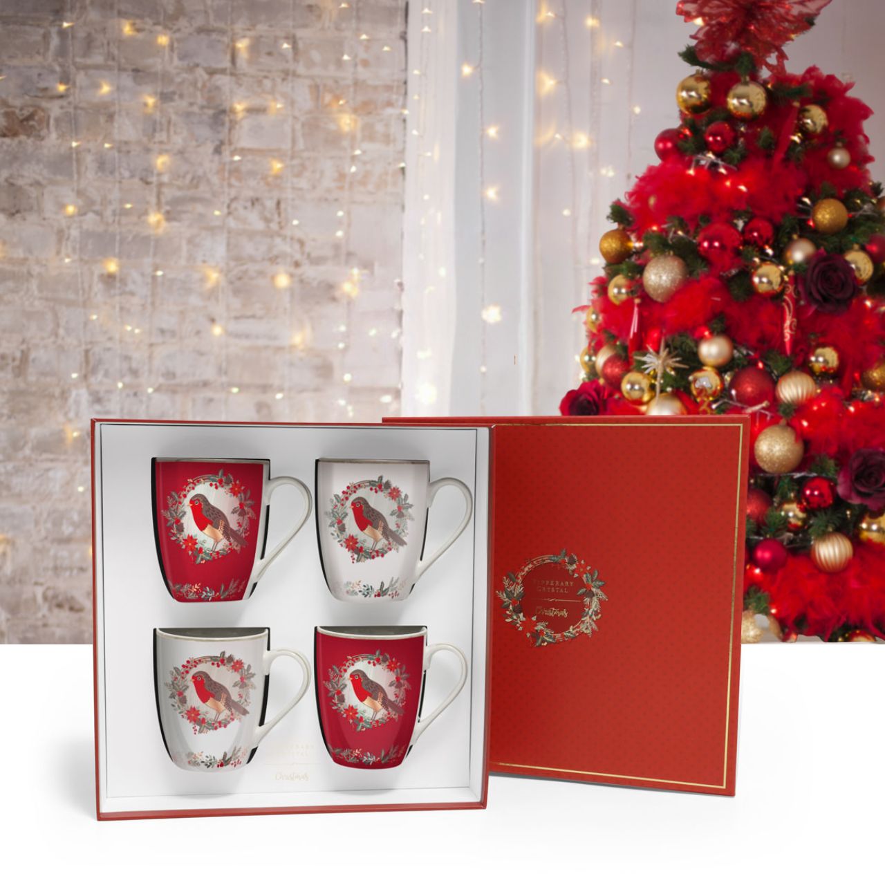 Birdy Set of 4 Christmas Robin Mugs by Tipperary Crystal  Gather your loved ones for a holiday celebration to remember. Our Christmas Tableware is made to bring festive happiness to lunch, dinner and every meal in between. 
