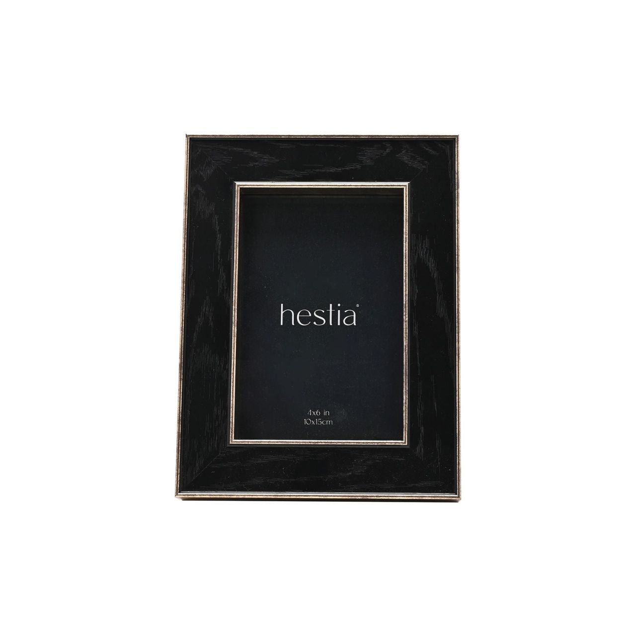 Introduce a touch of sophistication to your home with the Hestia Black Box Frame with Gold Edge. This striking piece, with its black matte finish and metallic gold border, gives your memories a chic and modern backdrop.
