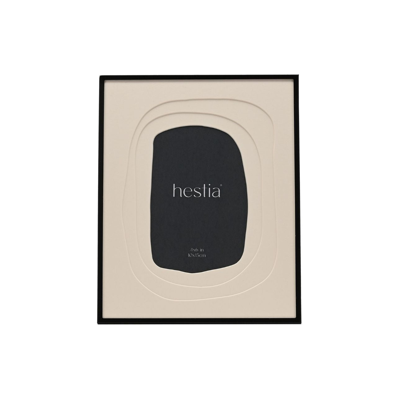 The Hestia Black Aluminium Photo Frame with Layered Mount is a striking piece for displaying memories. Its sleek black aluminium frame contrasts with the crisp white matte, highlighting the cherished 4x6 inch photograph at its centre.
