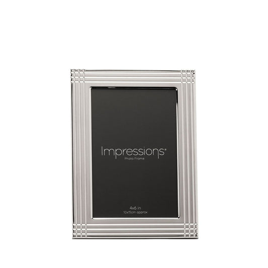 The Impressions Border Stripe Metal Plated Silver Photo Frame 4" x 6" offers a clean, contemporary way to display treasured photographs. Featuring a sleek silver-plated finish with subtle striped border detailing, it brings a refined touch to any home or office setting.