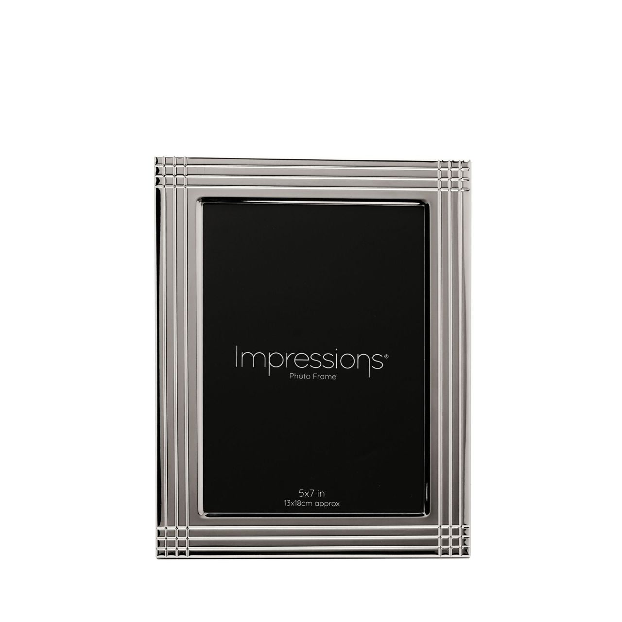 The Impressions Border Stripe Metal Plated Silver Photo Frame 4" x 6" offers a clean, contemporary way to display treasured photographs. Featuring a sleek silver-plated finish with subtle striped border detailing, it brings a refined touch to any home or office setting.