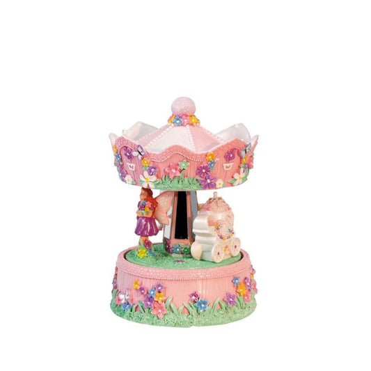 Music box Fairy Carousel. The colorful carousel, equipped with a fairy in a carriage, rotates to a melody.