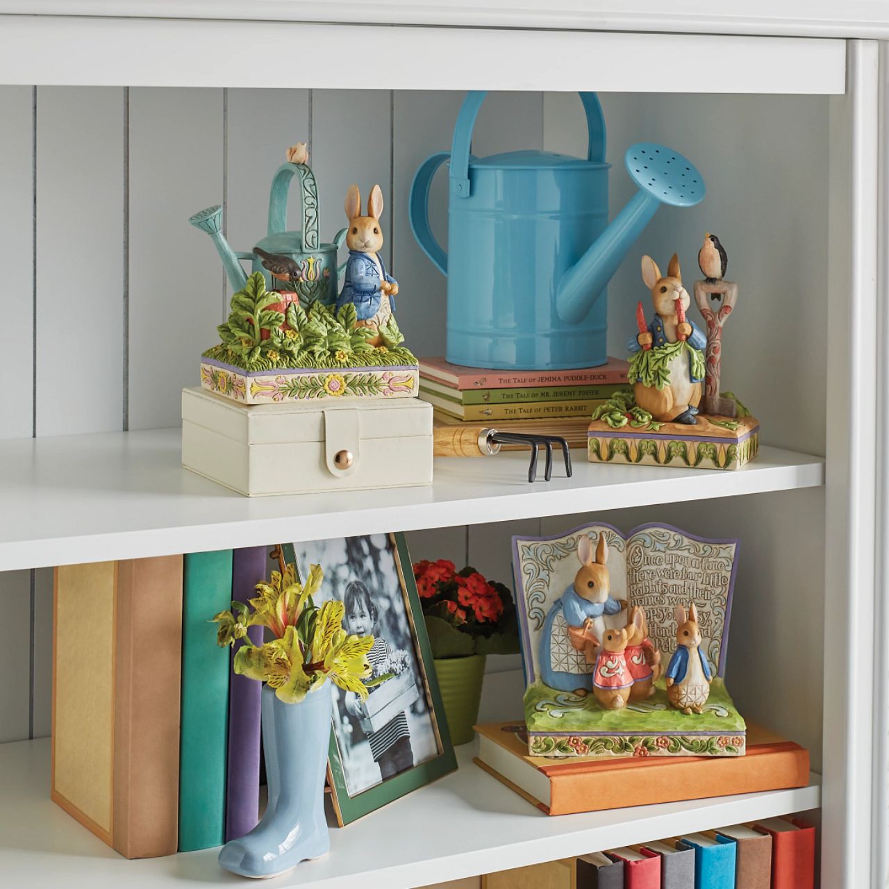 Award winning folk artist Jim Shore brings his unique style to Beatrix Potter's beloved story, The Tale of Peter Rabbit, through charming hand-crafted gifts that will delight her readers of all ages. This Jim Shore figurine features the adventurous Rabbit after he's squeezed under the garden gate to gorge on Mr. McGregor's garden vegetables again.