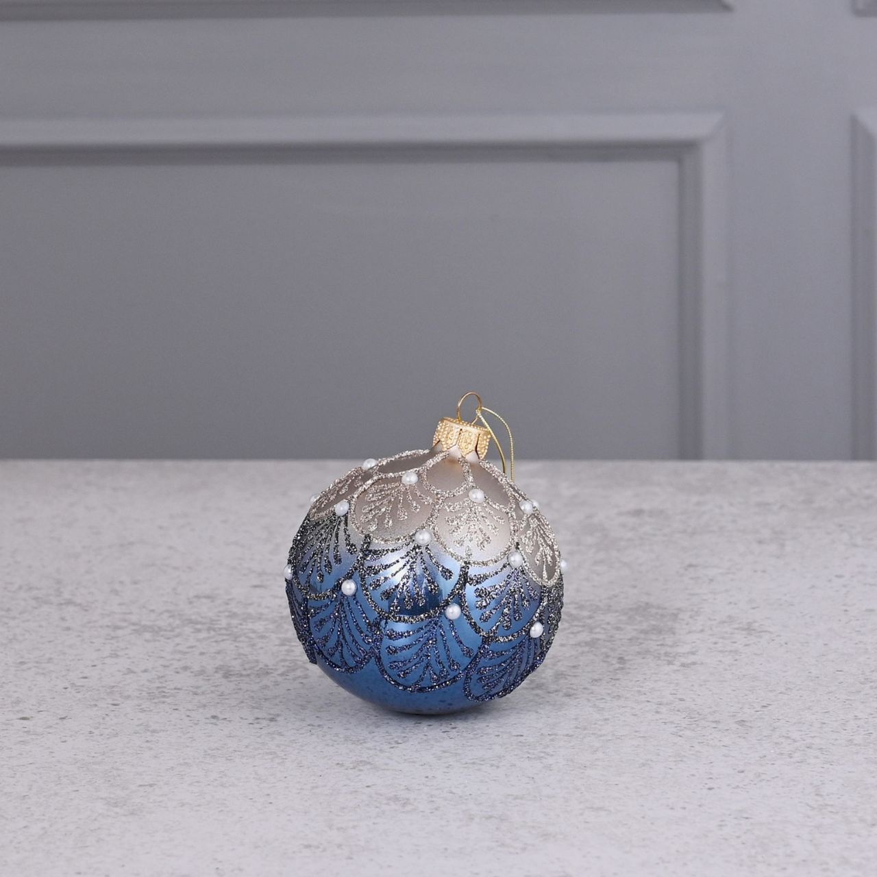 Celestial Blue Crystal Hand Decorated Ornamental Bauble  A blue hand decorated crystal bauble from THE SEASONAL GIFT CO.  This ornate Christmas bauble holds an abundance of elegance and will stand out amongst the tree branches this festive season.