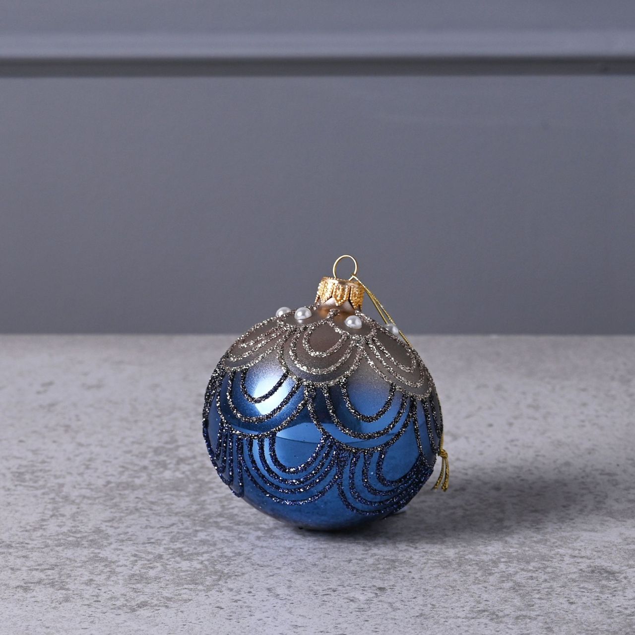 Celestial Blue Circular Hand Decorated Ornamental Bauble  A blue hand decorated ornamental bauble from THE SEASONAL GIFT CO.  This ornate Christmas bauble holds an abundance of elegance and will stand out amongst the tree branches this festive season.