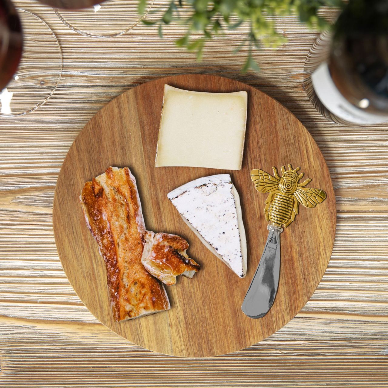 Round Acacia Cheese Board with Spreader Bee Design  A beautiful round acacia wood cheese board with gold bee stainless steel cheese spreader in a branded gift box. From the Cheese & Wine Gifts collection by HESTIA - elegant gifts for the sophisticated partygoer.