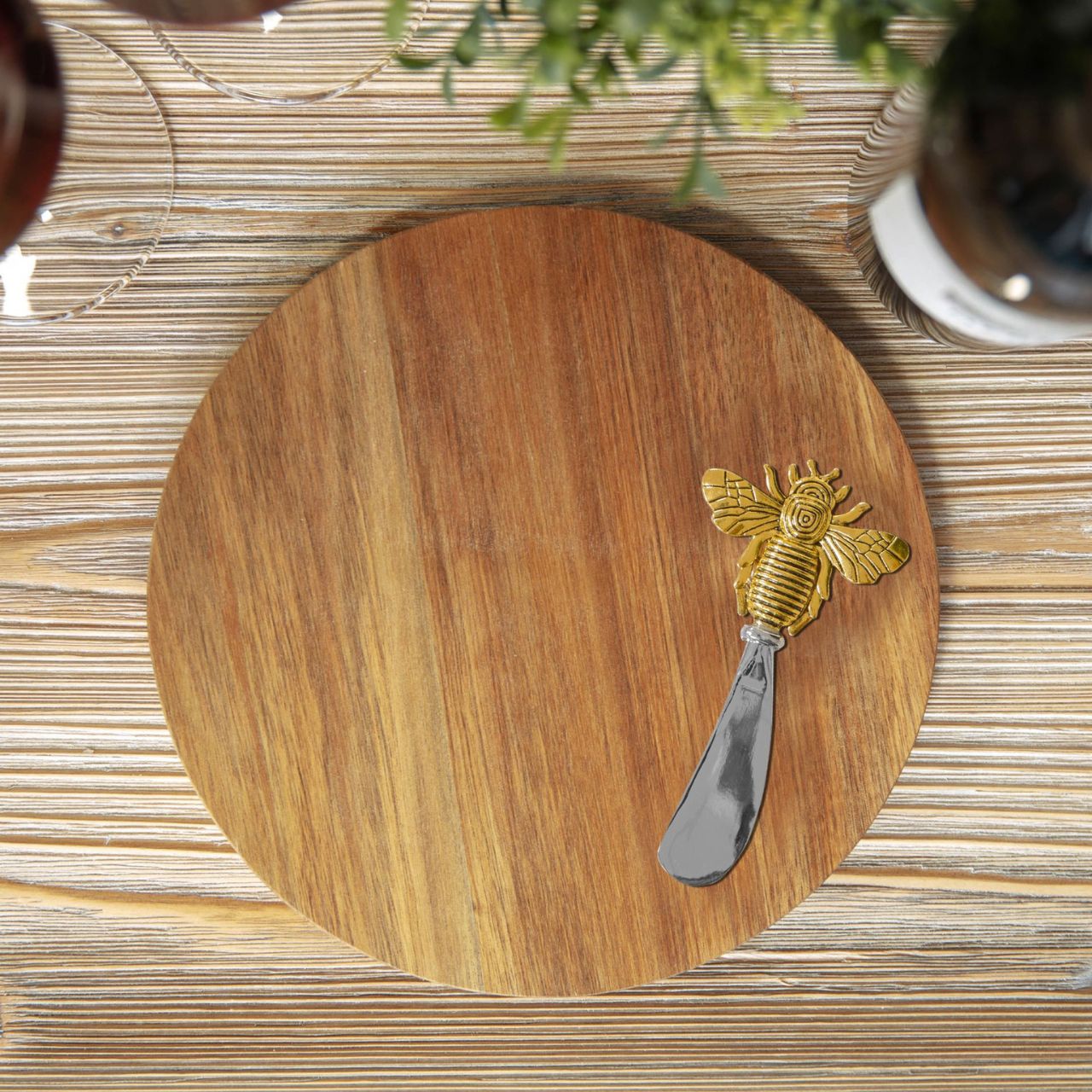 Round Acacia Cheese Board with Spreader Bee Design  A beautiful round acacia wood cheese board with gold bee stainless steel cheese spreader in a branded gift box. From the Cheese & Wine Gifts collection by HESTIA - elegant gifts for the sophisticated partygoer.