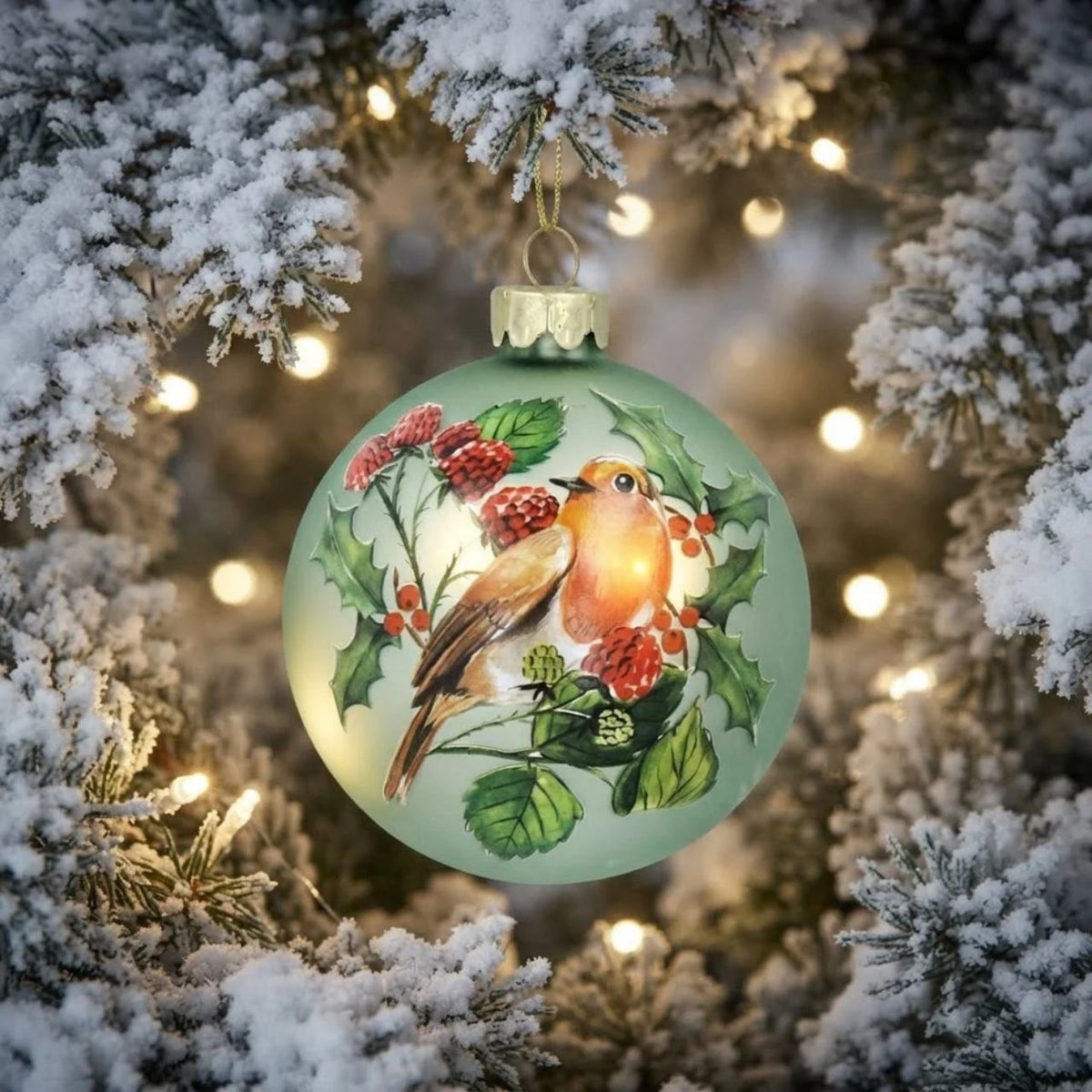 Add a touch of natural charm to your Christmas tree with these Gisela Graham Christmas Baubles. The matte pale green colour, adorned with a festive robin and fruit design, will bring a traditional and rustic feel to your holiday décor. Made with high-quality materials, these baubles are both durable and beautiful.