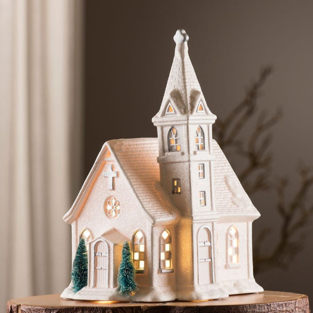 Christmas Church Lamp by Belleek Living  This Church Lamp is an exciting piece from Belleek Living. Shaped like a church the detail that this piece brings is exceptional. Timely pierced holes allow subtle light to shine through letting it reinact a Christmas scene of people in the church at the most special time of year. 