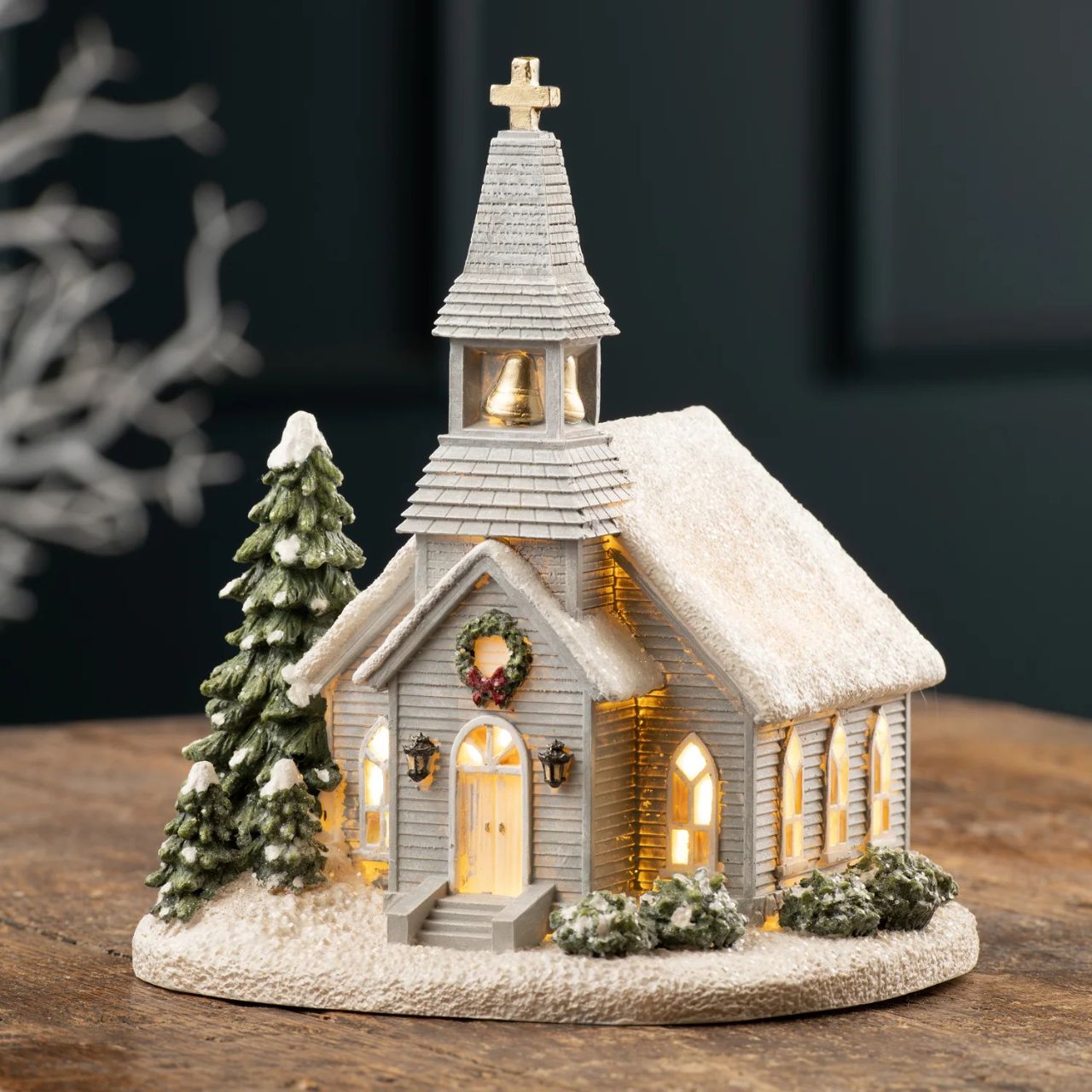 Bring the magic of Christmas to life with our Church LED Resin Figurine. This intricately designed figurine features a charming church illuminated with LED lights, evoking the cosy ambiance of a winter evening.
