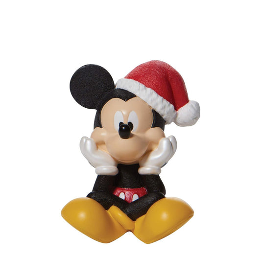 Department 56 Disney Christmas Mickey Mouse Figurine  Positively jolly, Mickey Mouse excitedly sits in this beautiful Christmas figure from Disney. With a song in his heart and holly in his hat, Mickey prepares to spend the season smiling. This is one mouse that won't be silent throughout the house.