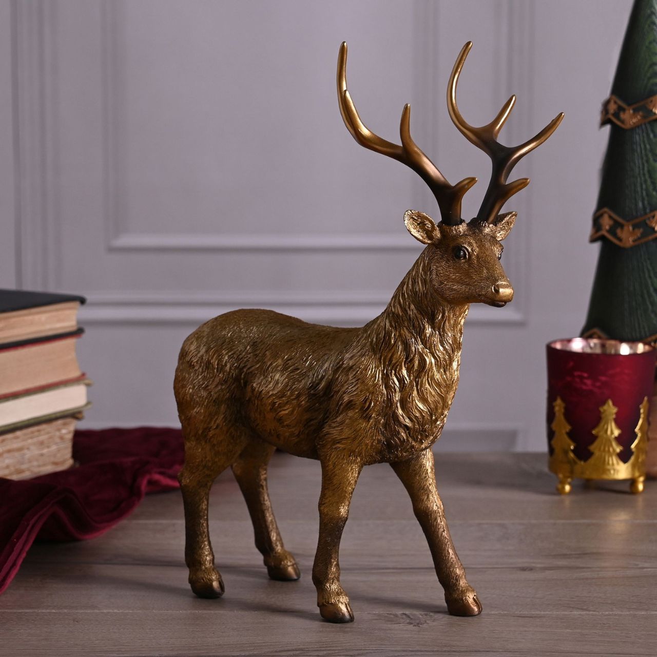 Christmas Standing Gold Stag  A standing gold stag by THE SEASONAL GIFT CO.  This eye-catching Christmas decoration commands attention when displayed at home over the festive period.