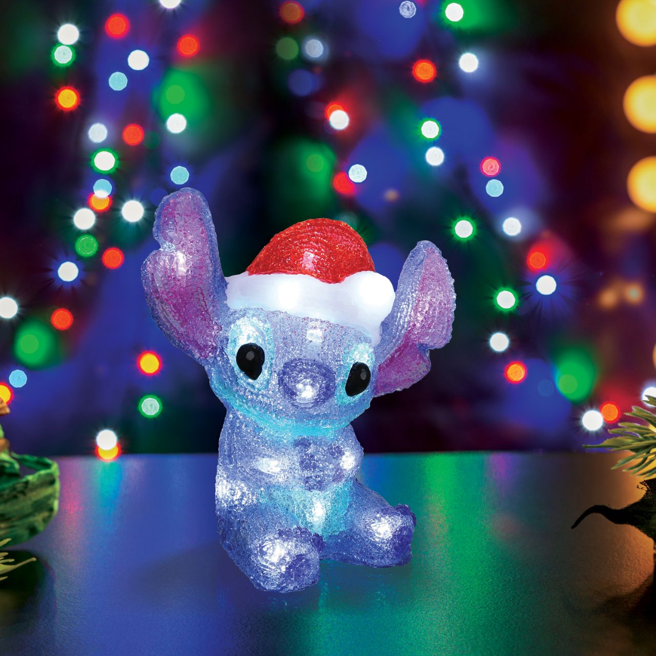 Add a touch of extra-terrestrial magic to your Christmas décor with this charming light-up Stitch| Sporting a festive Santa hat, its vibrant glow and playful design bring a unique flair to your celebrations.
