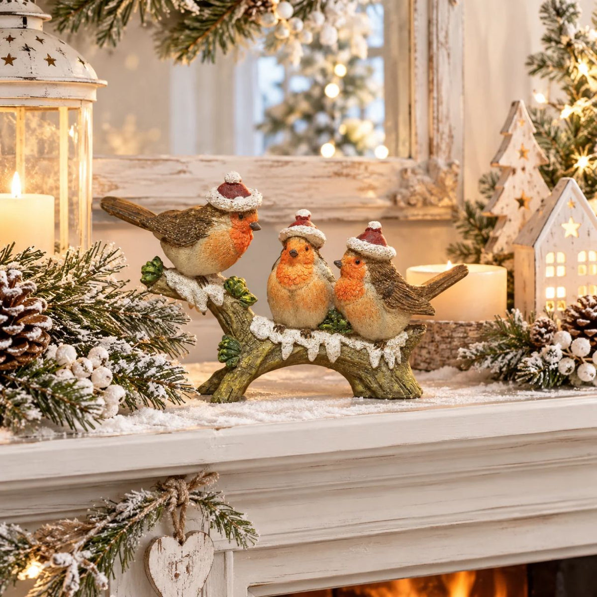 A hand painted three robins on a branch figurine. From the Enchanted Forest collection by Santa's Workshop - create your own winter wonderland.