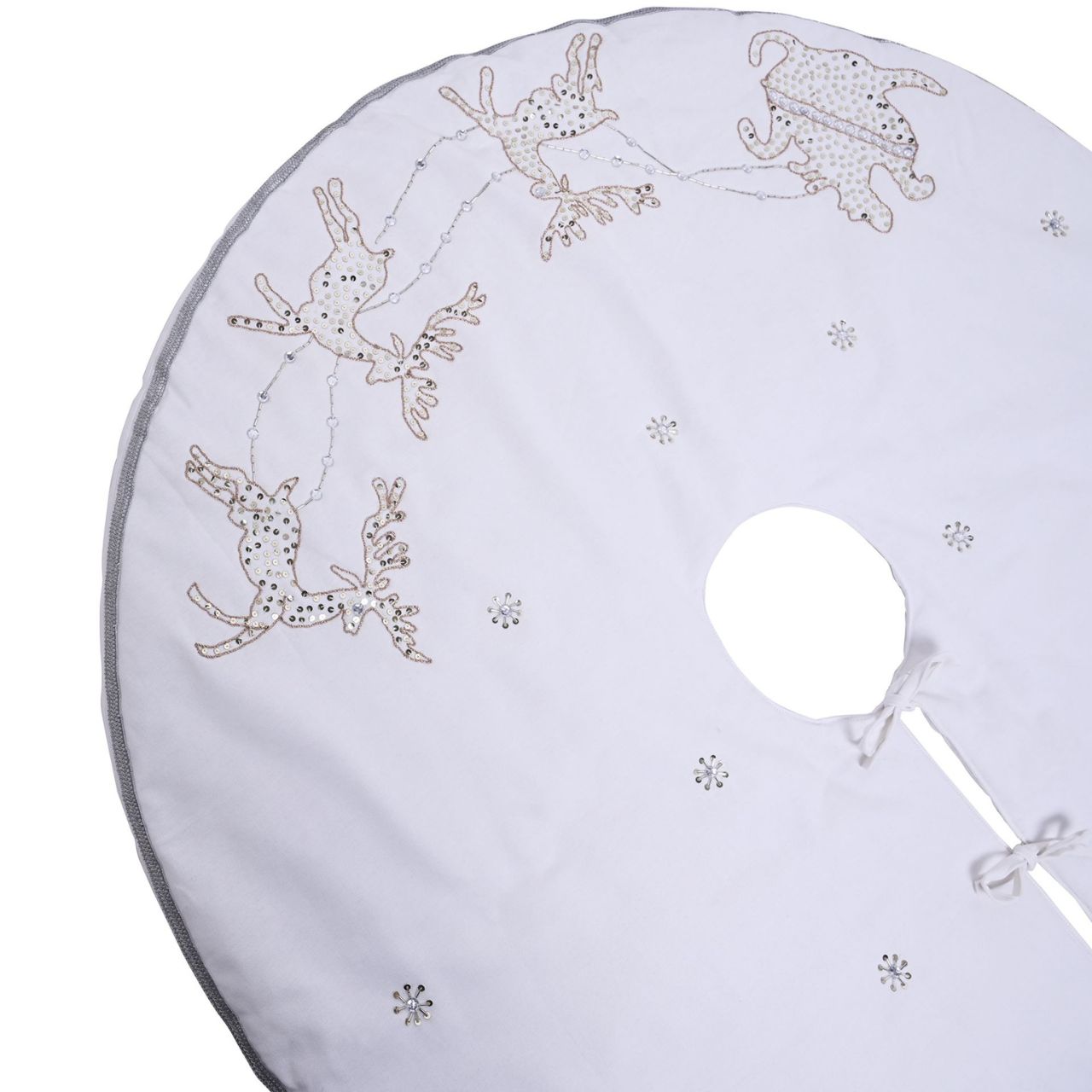 Christmas Tree Skirt White Reindeer Hand Embellished  A white reindeer hand embellished Christmas tree skirt from THE SEASONAL GIFT CO.  This standout accessory wraps itself around Christmas trees to accentuate its decoration.