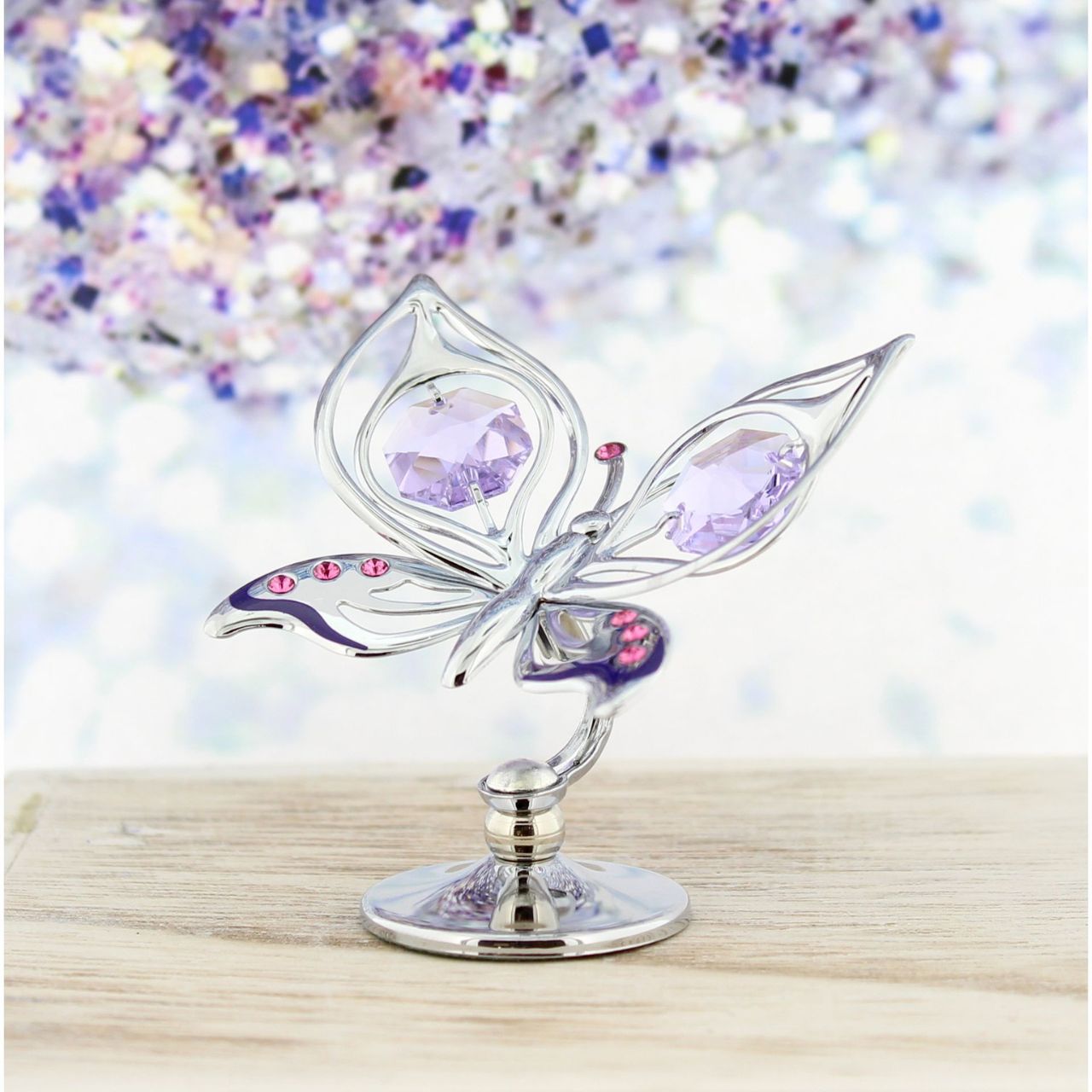 Crystocraft Chrome Plated Orchid Butterfly  A beautiful chrome plated butterfly ornament from Crystocraft. Embellished with world renowned, lilac Austrian Crystals on its wings and antennae to make an elegant and eye catching collectable ornament.