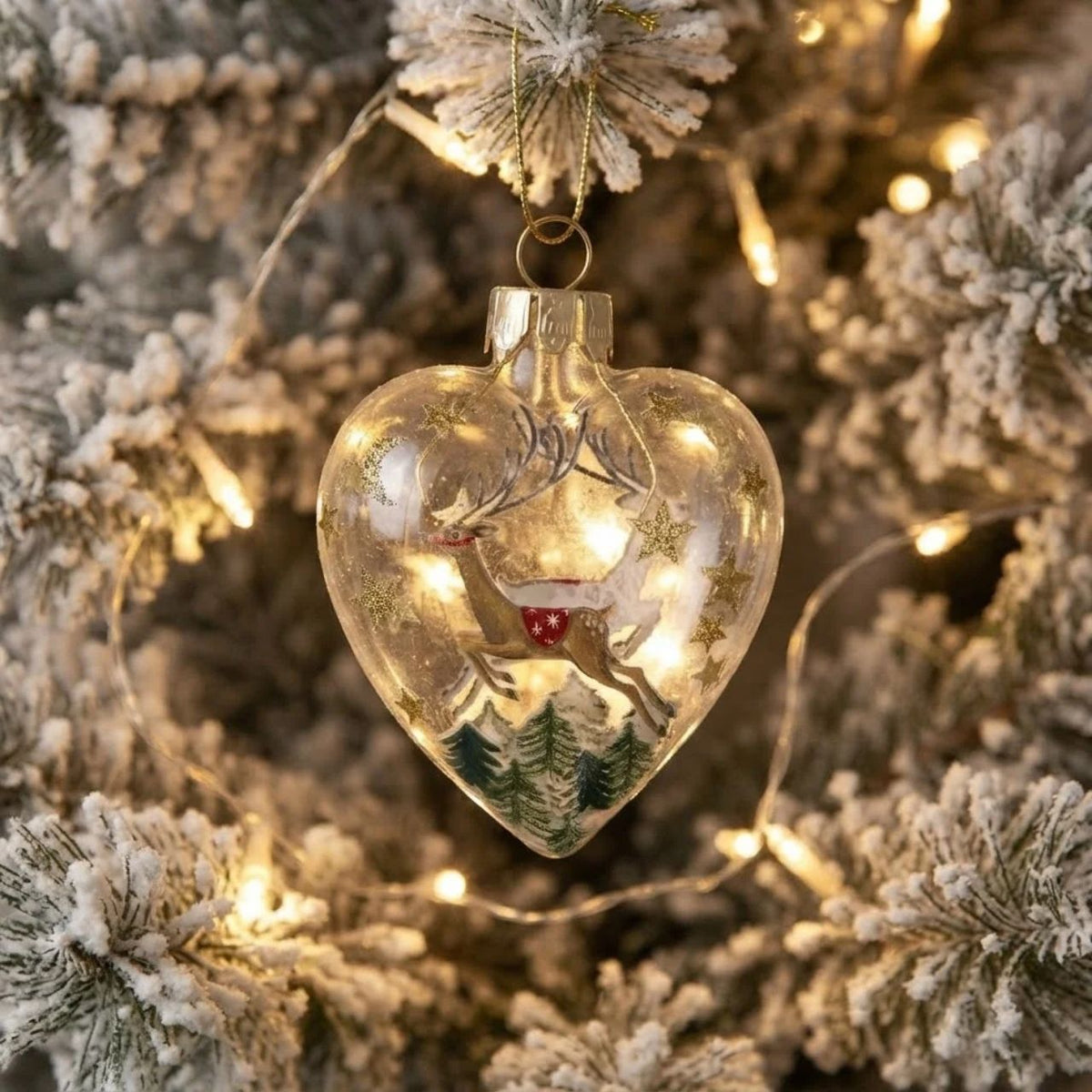 Gisela Graham Bring nostalgic charm to your tree with this elegant heart-shaped glass bauble from Gisela Graham. Choose between a delightful Santa on his sleigh or reindeer design, both beautifully rendered in clear glass for a timeless look.