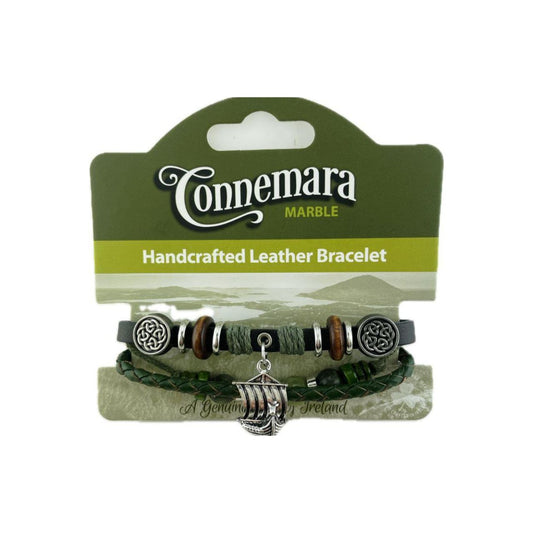 This Connemara Marble bracelet combines genuine leather with authentic Connemara marble, creating a unique accessory that reflects Ireland’s natural beauty. Featuring a detailed Viking ship charm, it evokes a rich heritage and adventurous spirit.