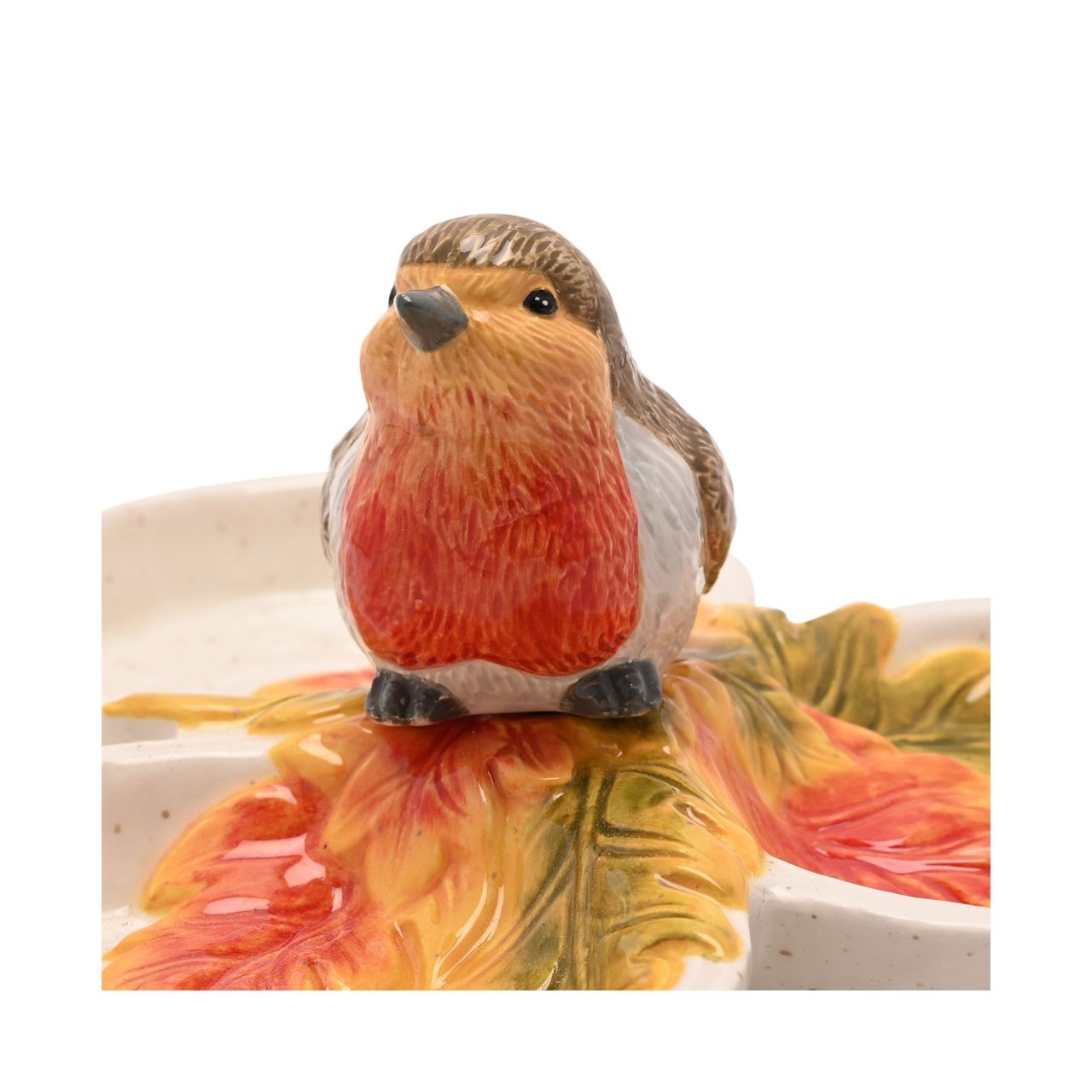 Featuring three connected dishes topped with a perched robin figurine, it’s ideal for serving seasonal nibbles like nuts, dried fruits, or sweets.