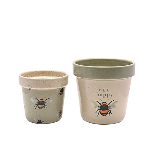 The ceramic duo showcases 2 different designs, the smaller having an all over bee pattern on a green speckled finish. The larger has the cherished sentiment of ‘Bee happy’ on a speckled cream surface. Both with contrast rims.