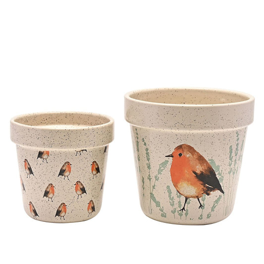 Country Living Set of 2 Planters - Robin  A set of 2 decorative planters by COUNTRY LIVIING  The ceramic duo showcases 2 different designs, the smaller having an all over Robin pattern on a speckled finish. The larger has two decorative images of a Robin, on a speckled cream surface.