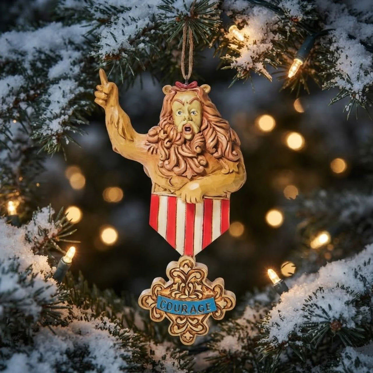 The Cowardly Lion has finally found his courage and it's in your tree! Bestowed with an impressive medal of honour, the no longer timid lion confidently rallies from his branch.