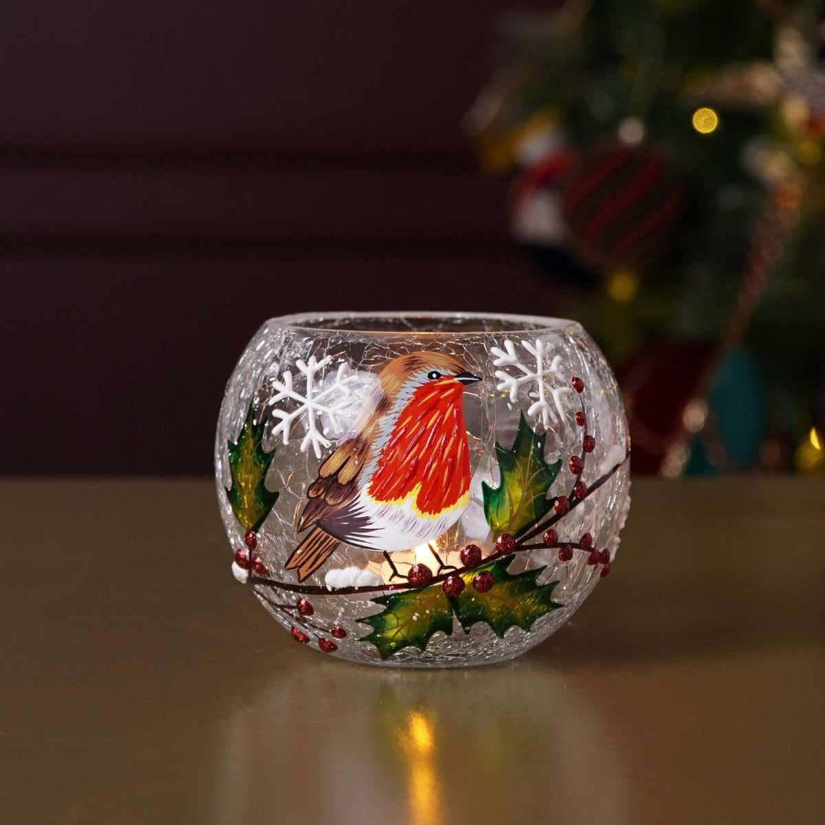 The Regal Tidings Crackle Effect Tea Light Holder Robin Design brings festive charm to seasonal interiors.