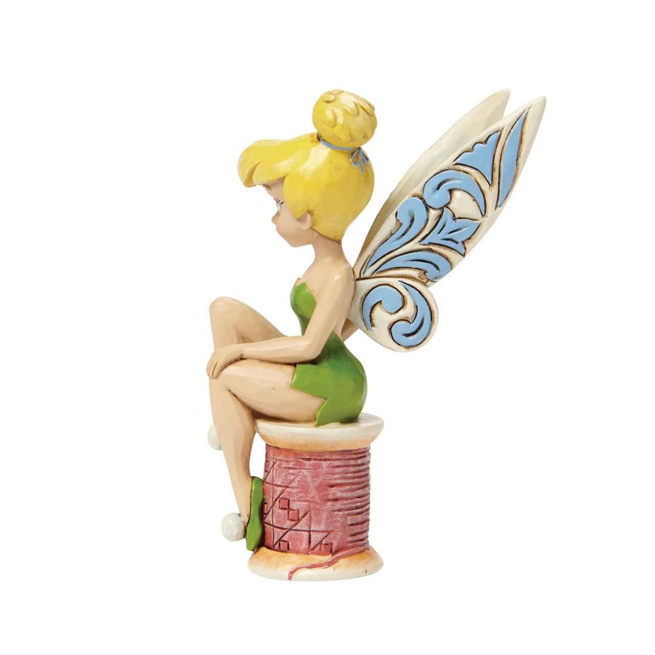 Disney Tinker Bell Crafty Tink Figurine  Tinker Bell takes a rest on a tiny spool of thread. Great for Tink lovers, Jim Shore collectors and sewing enthusiasts alike. A fun and flirty new personality pose from award winning artist and sculptor, Jim Shore.