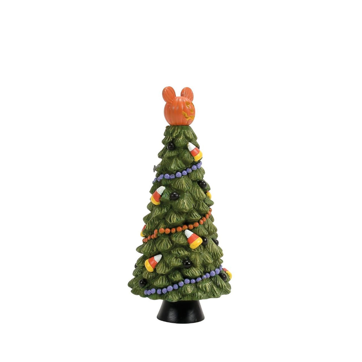 A small decorative Christmas tree figurine with a carved orange pumpkin topper, decorated with candy corn, black beads, and orange and purple garlands on a black base, isolated on a white background.