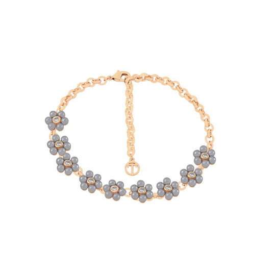 Elevate your elegance with the Tipperary Daisy Grey Pearl 9 Daisy Gold Bracelet. Featuring nine delicately crafted gold daisies paired with subtle grey pearls, this bracelet offers a refined balance of classic charm and contemporary sophistication.