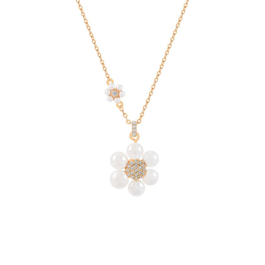 Elevate your elegance with the Tipperary Daisy Pearl Gold Pendant. Featuring a delicate gold daisy design embraced by a lustrous pearl, this pendant offers timeless sophistication.