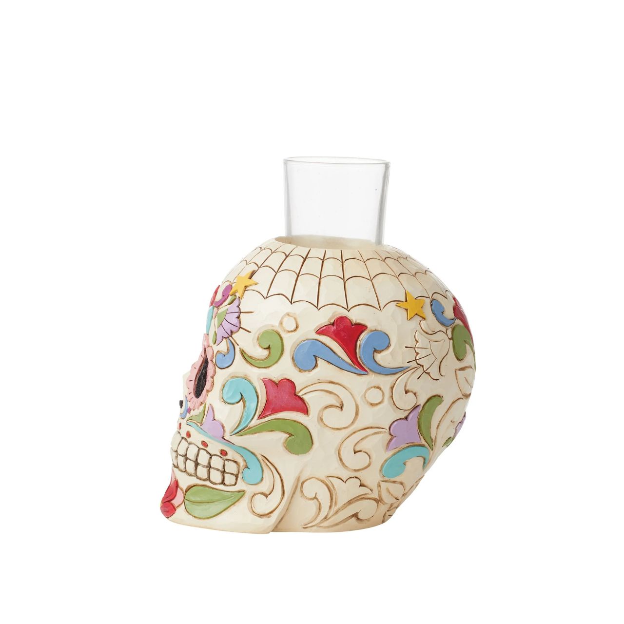 Designed in the iconic style of Jim Shore. This Day of the Dead purple skull candleholder is beautifully decorated with lively Mexican inspired pattern and colour. Modelled after a sugar skull. Hand painted in high quality cast stone. Designed by award-winning artist and sculptor Jim Shore for Heartwood Creek.
