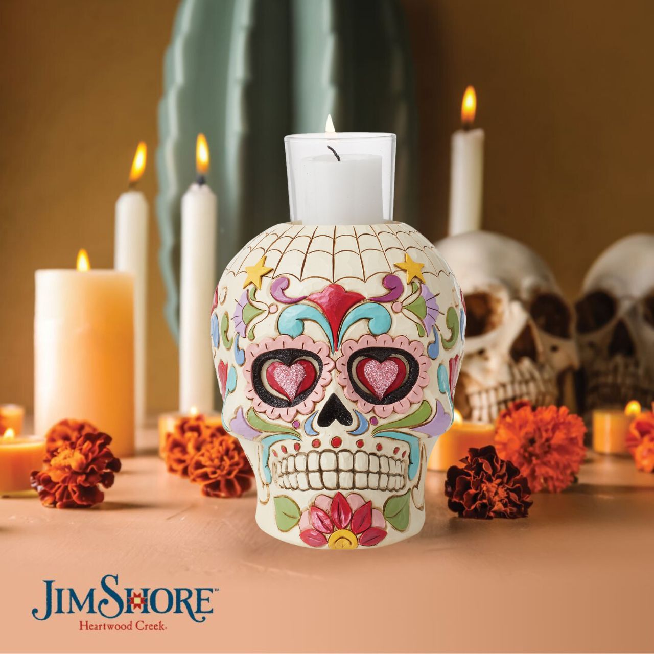 Designed in the iconic style of Jim Shore. This Day of the Dead purple skull candleholder is beautifully decorated with lively Mexican inspired pattern and colour. Modelled after a sugar skull. Hand painted in high quality cast stone. Designed by award-winning artist and sculptor Jim Shore for Heartwood Creek.