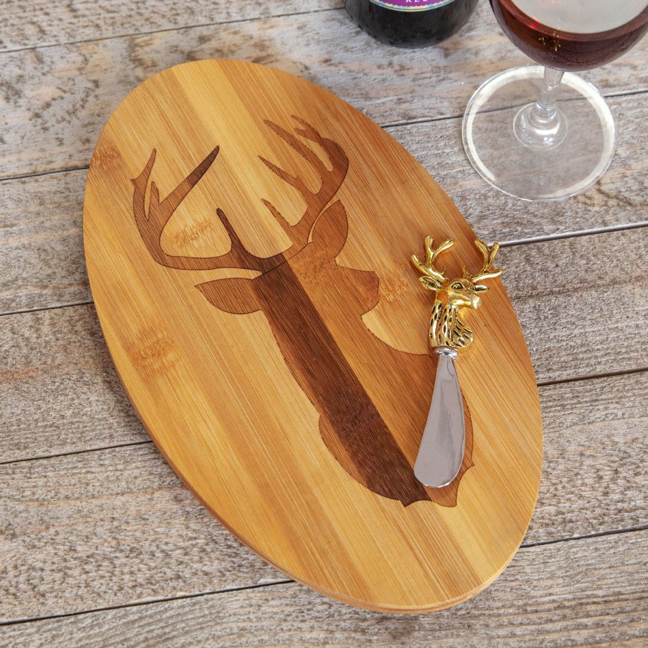 Bamboo Deer Head Laser Oval Chopping Board with Knife  Serve up an after dinner treat in festive style with this bamboo stag's head novelty cheeseboard and knife gift set.