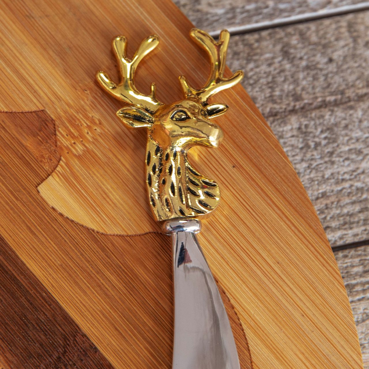 Bamboo Deer Head Laser Oval Chopping Board with Knife  Serve up an after dinner treat in festive style with this bamboo stag's head novelty cheeseboard and knife gift set.