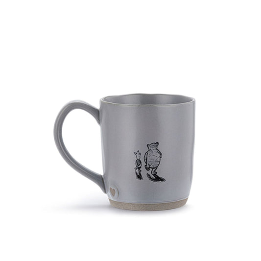 This charming Winnie the Pooh Forever Friends Mug is a delightful addition to any kitchen. Featuring Winnie the Pooh and Piglet, this mug is sure to bring a smile to your face and warmth to your heart with every sip.