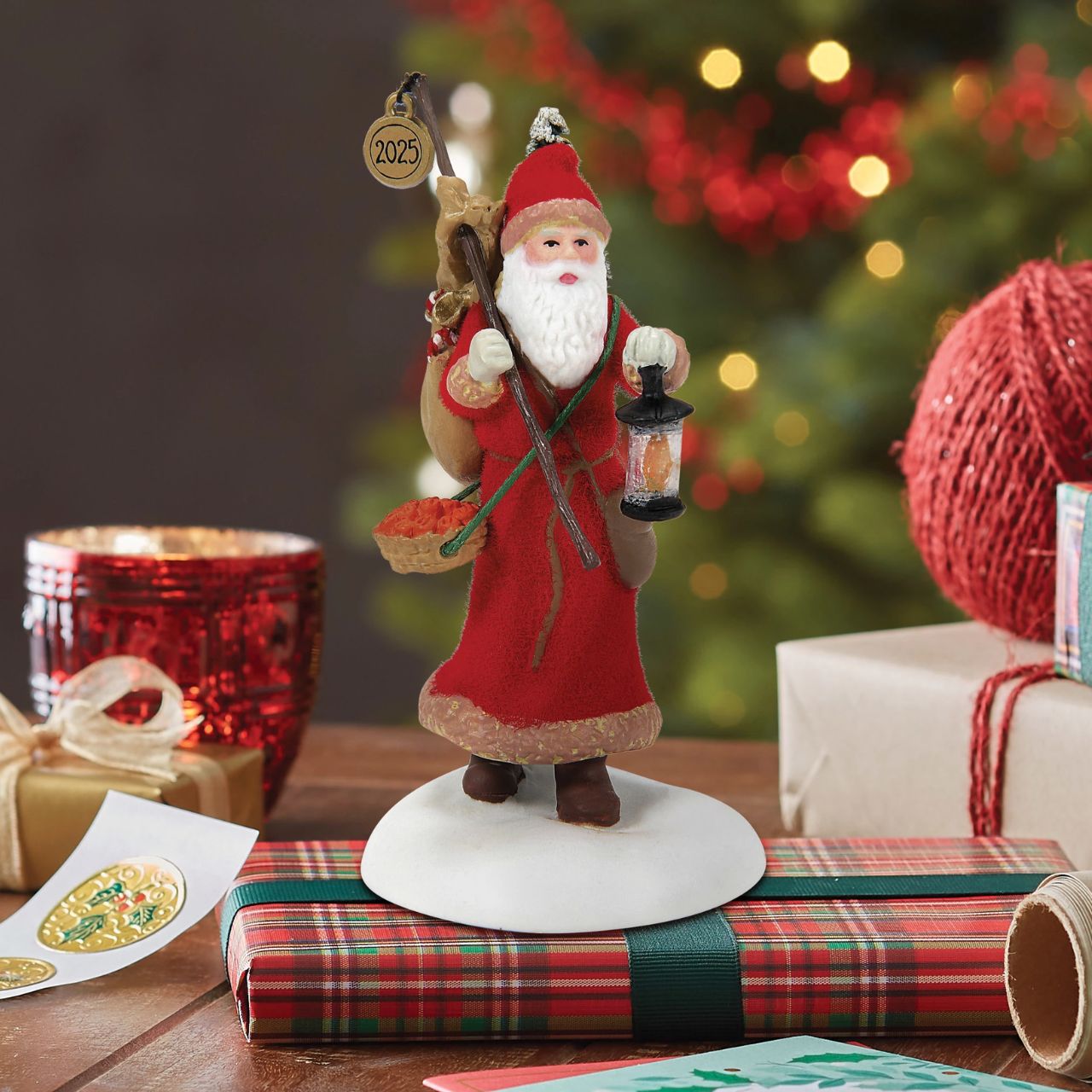Victorian England comes alive with this enchanting Department 56 Santa figurine from the Dickens' Village Series.