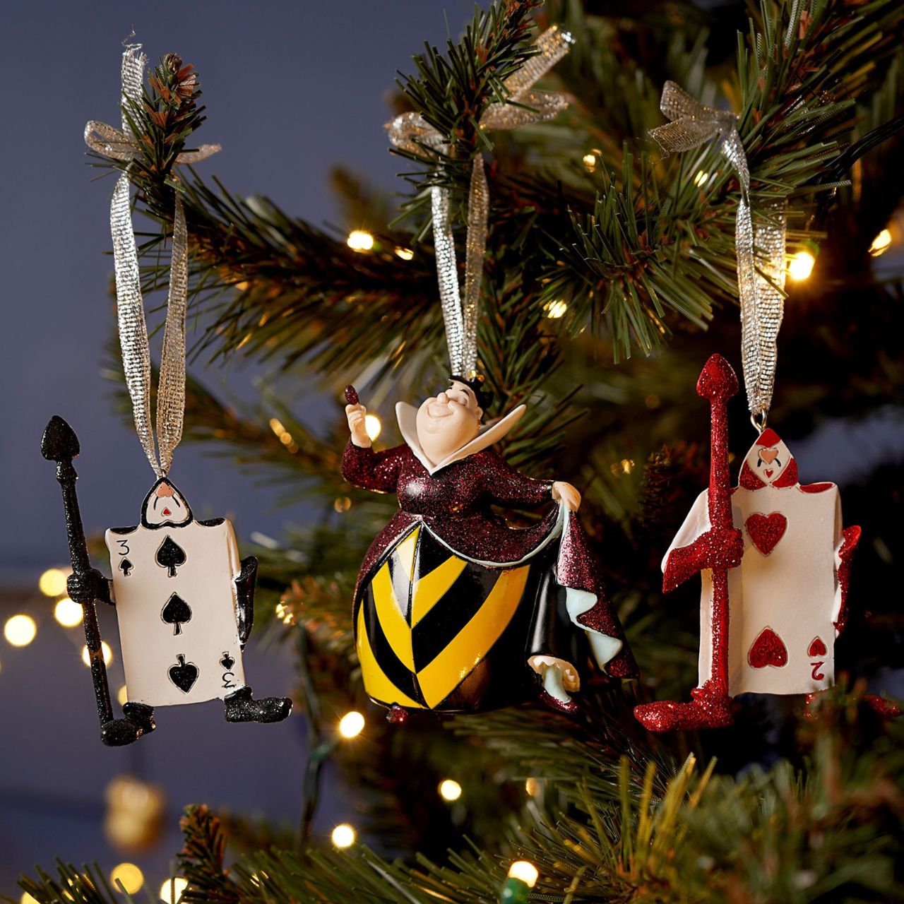 Bring some Disney magic to your home this Christmas. With two cards and a red queen figurine, these characterful ornaments are sure to make any tree a little more special this year.