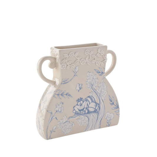 Crafted from ceramic in beige, it comes with blue and white magical imagery. This vase is a celebration of the Cheshire Cat character.