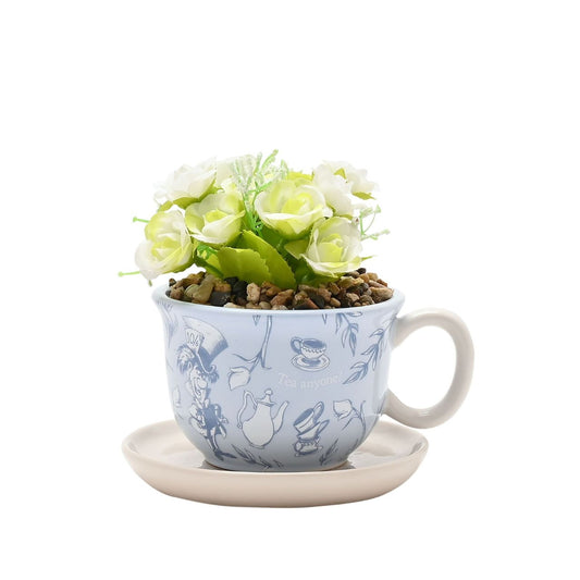 A Disney Alice in Wonderland Teacup Planter with Faux Plant, an officially licensed product that is tailor-made for superfans.