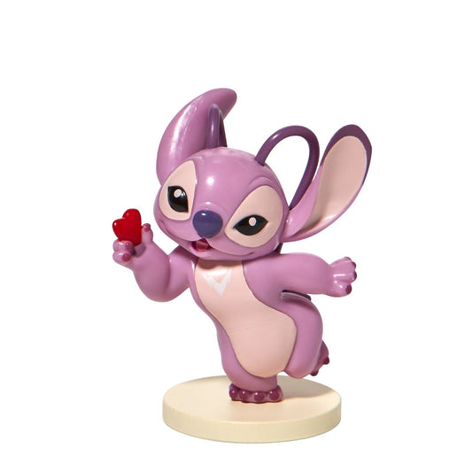 Stitch Angel with Heart Mini Figurine  This super cute Angel mini figurine is holding a little red heart just for you. Angel is the girlfriend of Stitch and is sweet and loving. This is the perfect addition to any Stitch or Disney collection. Made from high quality vinyl.