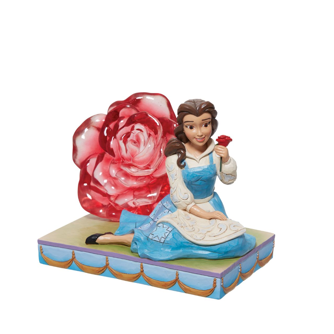 This Disney Traditions line by Jim Shore features iconic Walt Disney princesses with their famous props highlighted. With a base illustrating her story, this piece features Belle with a with her signature red rose.
