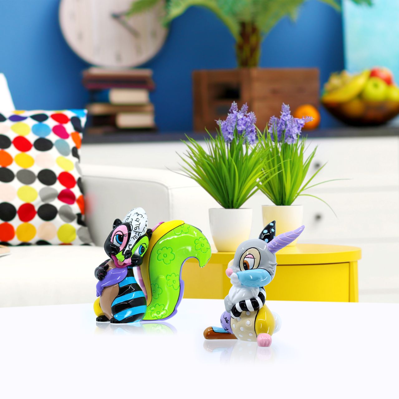 Experience a dash of whimsy with the Disney Flower Mini Figurine byt Romero Britto. Crafted with vivacious colours and unmatched artistic flair, this figurine brings like to Disney's charming character in Britto's signature pop-art style.