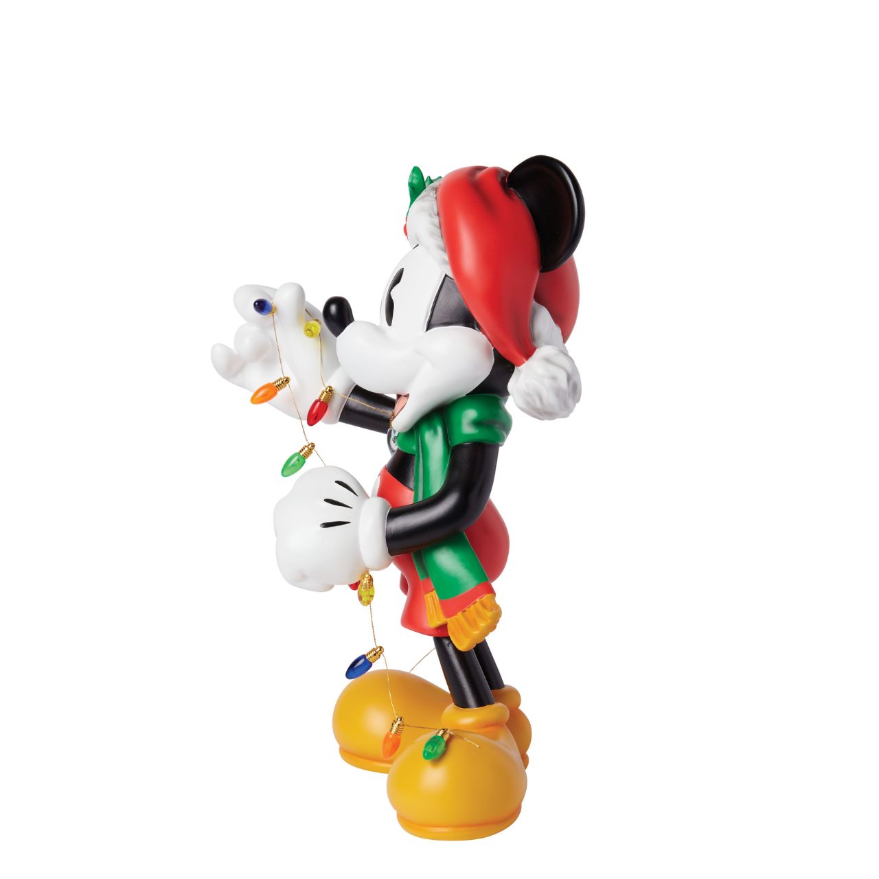 The Holiday Mickey Figurine by Disney Showcase is a fantastic gift for lovers of Disney's iconic mouse. Standing over 30cm tall and dressed in his festive outfit whilst holding a string of Christmas lights, this Mickey figurine is a delightful display piece that will be admired by all those who see it. 