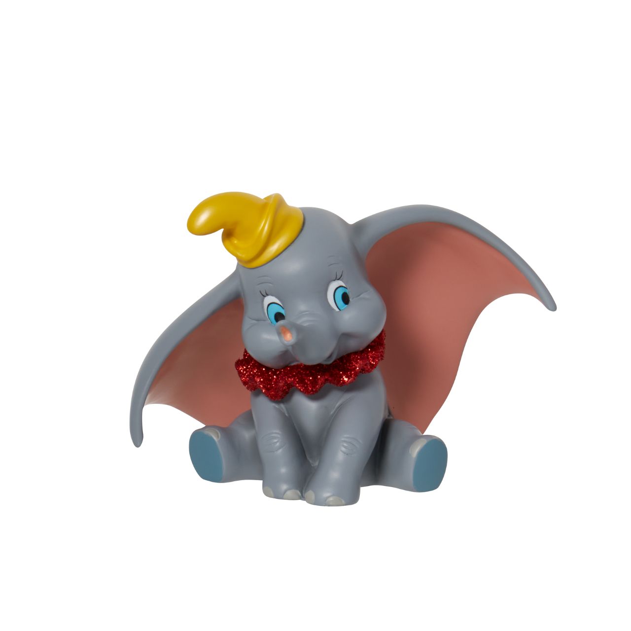 Everyone's favourite flying elephant looks circus-ready in this adorable pose by Disney Showcase. This realistic figurine has a beautiful finish complete with red glitter. This is a great addition to any nursery and is not a toy or children's product.